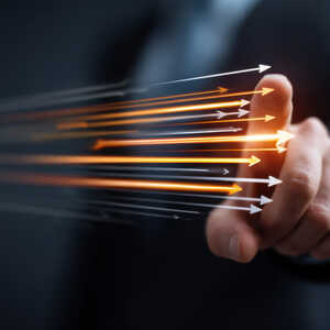 A finger following arrows moving across the screen, representing Our Vision